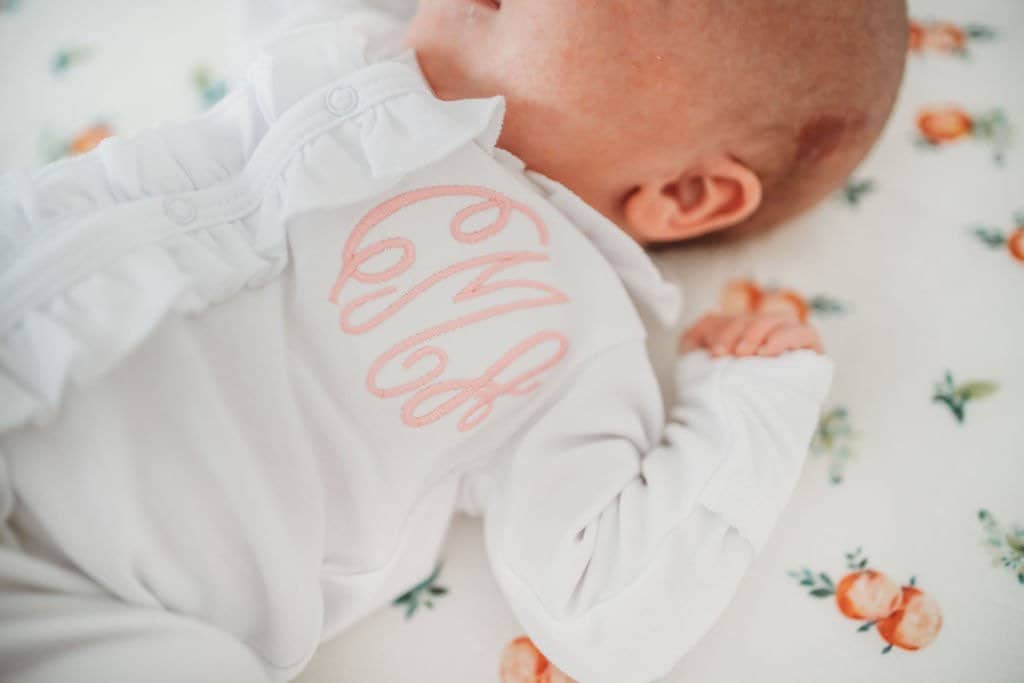 Magnolia Baby Girls Anna's Classics White Scattered Ruffle Footie main image 1