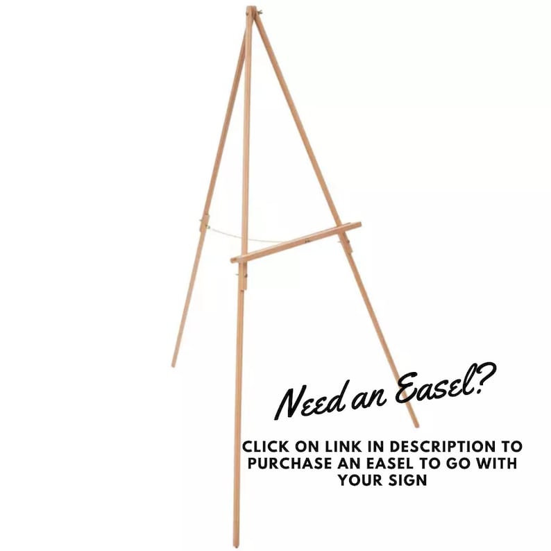 May include: A wooden easel with a light brown finish. The easel is made of three legs that form a triangular base. The easel is designed to hold a sign or artwork.