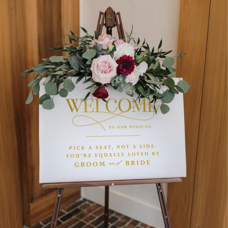 Acrylic Sign that says welcome to our wedding pick a seat not a side