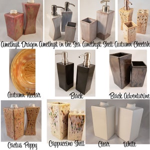 May include: Assortment of ceramic soap dispensers in various colors and patterns, including amethyst, black, white, and brown. The dispensers are arranged in pairs, with each pair featuring a different design.