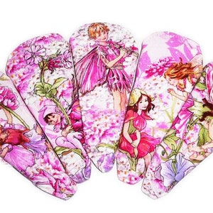 May include: Set of six pink hair clips featuring fairies and flowers. Each clip has a different fairy design with pink, white, and green accents.