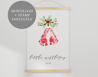 May include: Printable Christmas baby footprint art with a red and green watercolor wreath and the text "little mistletoes 2024".