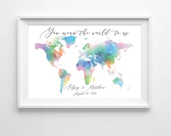May include: A watercolor world map with a rainbow color scheme. The text "You mean the world to us" is written at the top of the map. The names "Kelsey & Matthew" and the date "August 18, 2019" are written below the map.