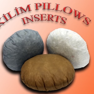 May include: Three round pillow inserts in gray, brown, and white. The text "Kilim Pillows Inserts" is written in red above the pillows.