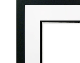 May include: Black picture frame with a white mat and a black inner mat. The frame is ready to display a photo or artwork.