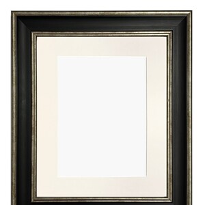 May include: A black picture frame with a silver trim. The frame has a white mount and is ready to display a photo or artwork.