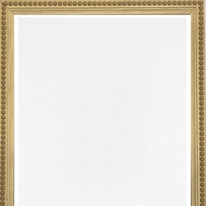May include: A simple, plain, gold-coloured picture frame with a beaded border.