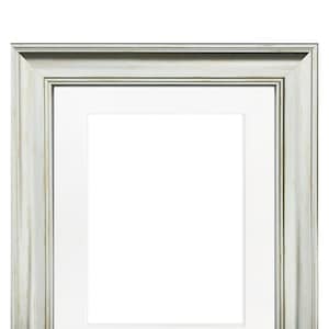 May include: A silver picture frame with a white mount. The frame has a distressed look and a slightly raised edge.