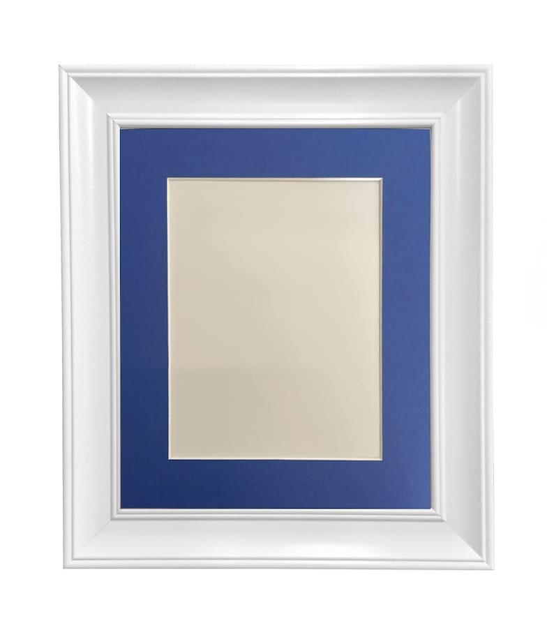 May include: White picture frame with a blue mat. The frame has a simple, classic design.