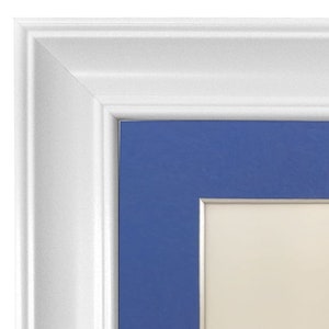 May include: White picture frame with a blue mat and a silver inner border. The frame is made of wood and has a simple design.