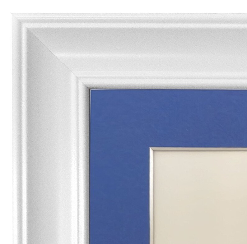 May include: White picture frame with a blue mat and a silver inner border. The frame is made of wood and has a simple design.