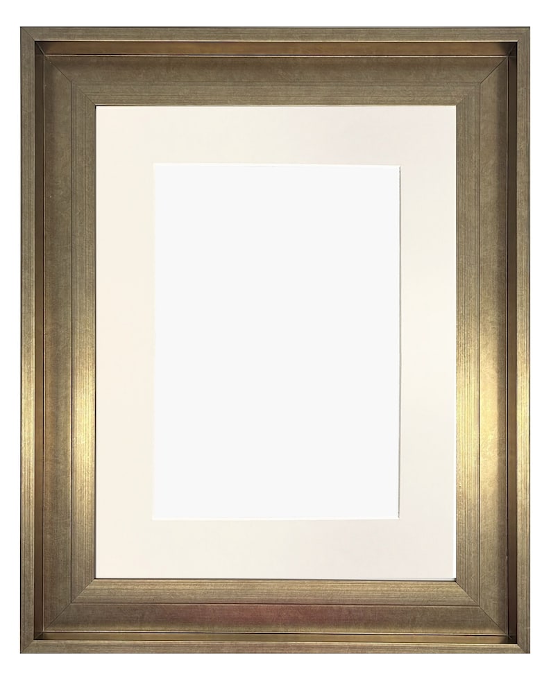 May include: A gold-toned picture frame with a white mat. The frame has a simple, classic design.