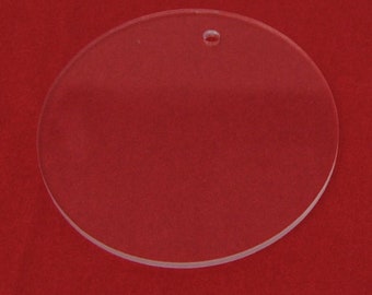 May include: A clear round acrylic ornament with a hole for hanging.