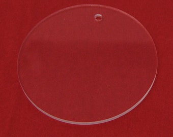 May include: A clear round acrylic ornament with a hole at the top for hanging.