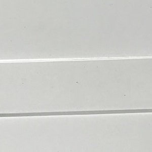 May include: A clear rectangular acrylic blank for crafting projects.