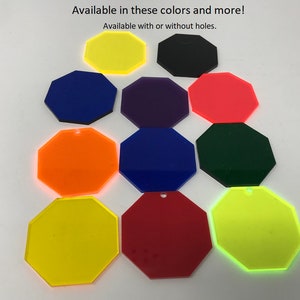 May include: Assortment of octagon-shaped acrylic blanks in various colors, including yellow, orange, red, green, blue, purple, and black. Available in these colors and more! Available with or without holes.