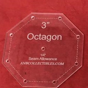 May include: A clear plastic template for sewing an 8-sided 3-inch octagon with a 1/4-inch seam allowance. The template is labeled "3" Octagon" and "ANBCOLLECTIBLES.COM".