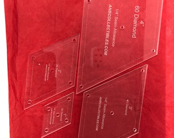 May include: Four clear plastic diamond-shaped quilting templates with 1/4 inch seam allowance. The templates are labeled 60 Diamond and measure 1 inch, 2 inches, 3 inches, and 4 inches. The templates are for use with quilting projects.