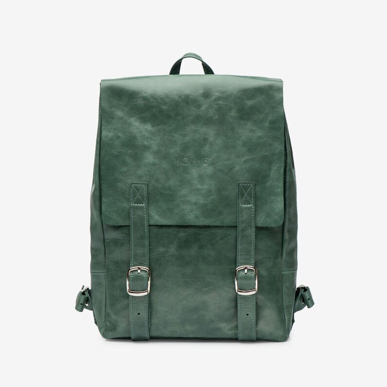 green backpack leather