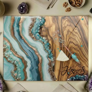 May include: Rectangular wooden serving board with a turquoise and gold resin design on one side and a wood grain pattern on the other. Includes a cheese knife and the text "Design 6".