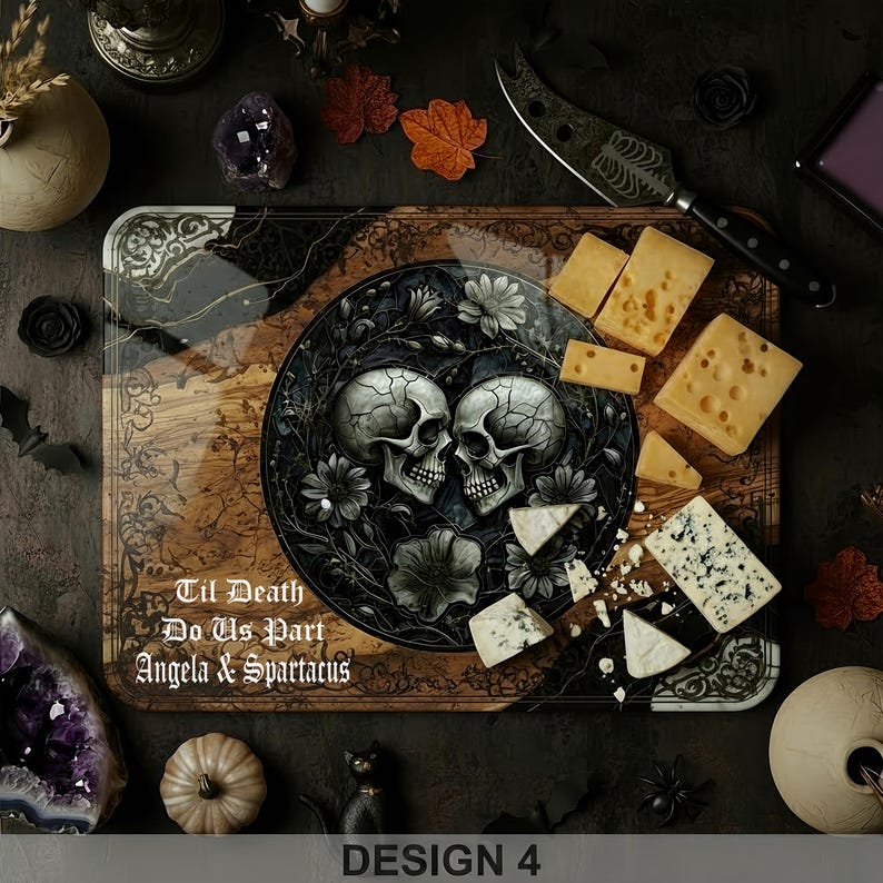 May include: A decorative wooden serving board with a skull design and the text "Til Death Do Us Part Angela & Spartacus". The board is surrounded by cheese, a knife, and decorative items. Design 4.