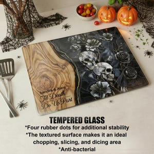 May include: A rectangular tempered glass cutting board with a wood grain design on the left and a floral skull design on the right. The text "Sandra & Alex Til Death Do Us Part" is visible. The board has four rubber dots for stability.