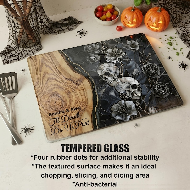 May include: A rectangular tempered glass cutting board with a wood grain design on the left and a floral skull design on the right. The text "Sandra & Alex Til Death Do Us Part" is visible. The board has four rubber dots for stability.