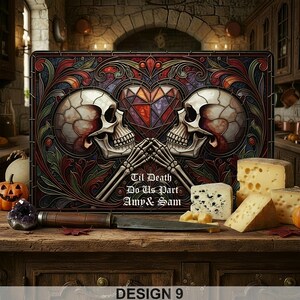 May include: A decorative cutting board with a stained glass design featuring two skulls, a heart, and the text "Til Death Do Us Part Amy & Sam." The board is surrounded by cheese, a knife, and a carved pumpkin. The words "DESIGN 9" are at the bottom.