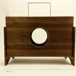 May include: A dark brown wooden box with a circular mirror and a gold-colored handle. The box is 45 cm wide and 42 cm tall (approximately 17.7 inches wide and 16.5 inches tall). The design features a minimalist aesthetic.