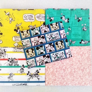 May include: Four different fabric squares featuring Mickey Mouse and Donald Duck in various cartoon poses. The fabrics are yellow, green, pink, and white with red stripes.