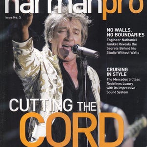 May include: Magazine cover featuring a singer with a microphone, titled "harmanpro." The cover includes the text "CUTTING THE CORD" in large orange letters, and mentions Rod Stewart and Kanye West.