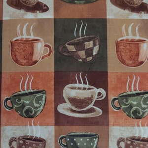 May include: A colorful fabric with a repeating pattern of coffee cups with steam rising from them. The cups are in various colors and patterns, including brown, green, and white.
