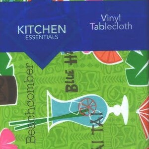 May include: A green vinyl tablecloth with a tropical theme. It features images of tiki drinks, palm trees, and the words "Blue Hawaii", "Mai Tai", and "Beachcomber". The text "Kitchen Essentials" and "Vinyl Tablecloth" are printed on a blue label.