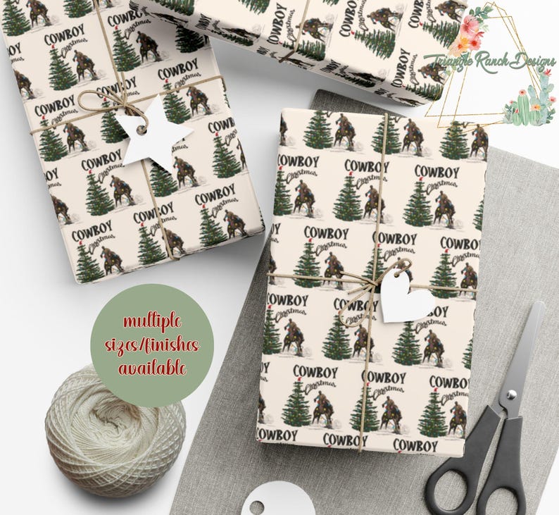 May include: A sheet of wrapping paper with a cream background and a repeating pattern of green Christmas trees with red ornaments and cowboys riding horses. The text "Cowboy Christmas" is repeated throughout the pattern.