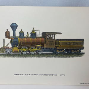 May include: An illustration of a Mogul Freight Locomotive from 1878. The train is brown, black, and gold, with a black smokestack and a detailed design. The image is on a cream-coloured background. The text "MOGUL FREIGHT LOCOMOTIVE 1878" is below the train.