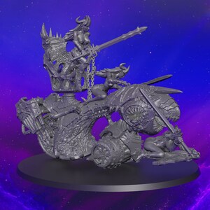 May include: A detailed gray fantasy sculpture featuring multiple figures. One figure is seated on a throne, holding a sword, while others ride a creature with sharp teeth. The sculpture is set on a black base.