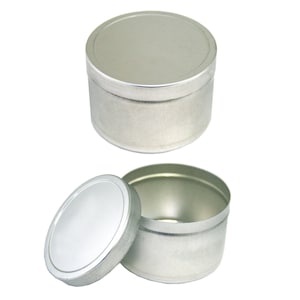 May include: A silver metal container with a lid. The container is round and has a smooth surface. The lid is also round and has a smooth surface.