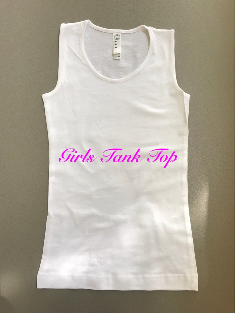 May include: White sleeveless tank top with the text "Girls Tank Top" printed in pink.