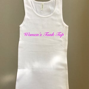 May include: White tank top with the text "Women's Tank Top" in pink lettering.
