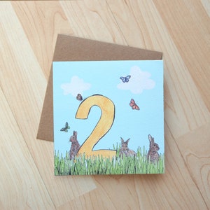 Cartão de ilustração do 2º aniversário do Rabbit Meadow impresso em cartão ecológico