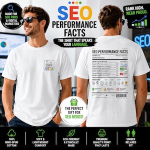 May include: A white t-shirt featuring a small square logo on the front chest with the text Organic Search Visibility and four colored squares. The back displays a large nutrition-style label titled SEO Performance Facts with data and icons.
