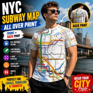 May include: A white short-sleeve t-shirt featuring an all-over print of the New York City subway map with colorful transit lines. The design covers the front and back of the garment, displaying a detailed network of routes and station labels.
