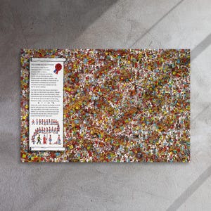 May include: A framed canvas print featuring a detailed illustration with numerous figures in various outfits. A scroll with text and a red and blue ribbon is on the left. The print has a busy, colorful design.