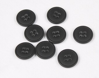 12 buttons, polyester, black, 15mm, 18mm or 22mm, 4 holes (8132-ST)