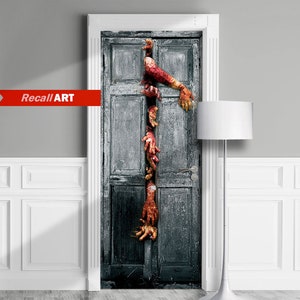 May include: A door decal featuring a spooky scene of multiple zombie hands reaching out from behind a weathered wooden door.