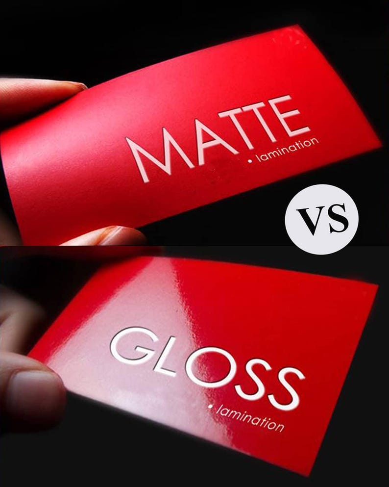 May include: A comparison of red business cards with white text. One card reads "MATTE" with "lamination" below. The other card reads "GLOSS" with "lamination" below. A white circle with "VS" is between the cards.