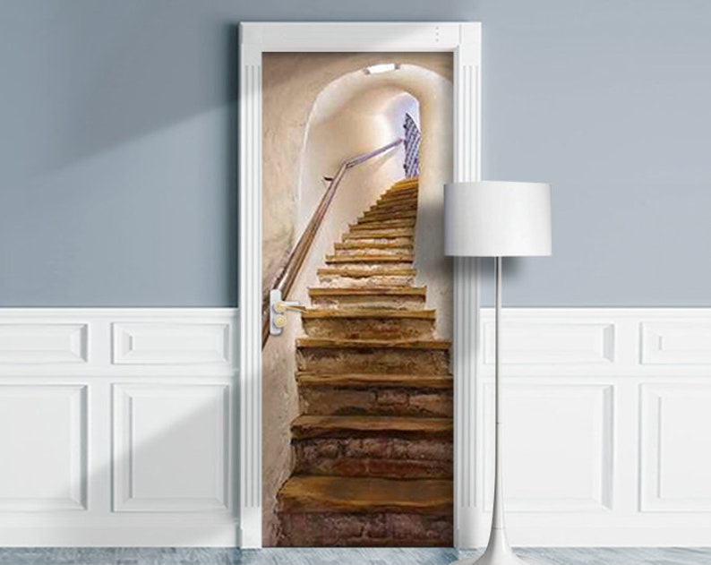 May include: A door decal featuring a realistic image of a stone staircase leading up to a light-filled arched doorway.