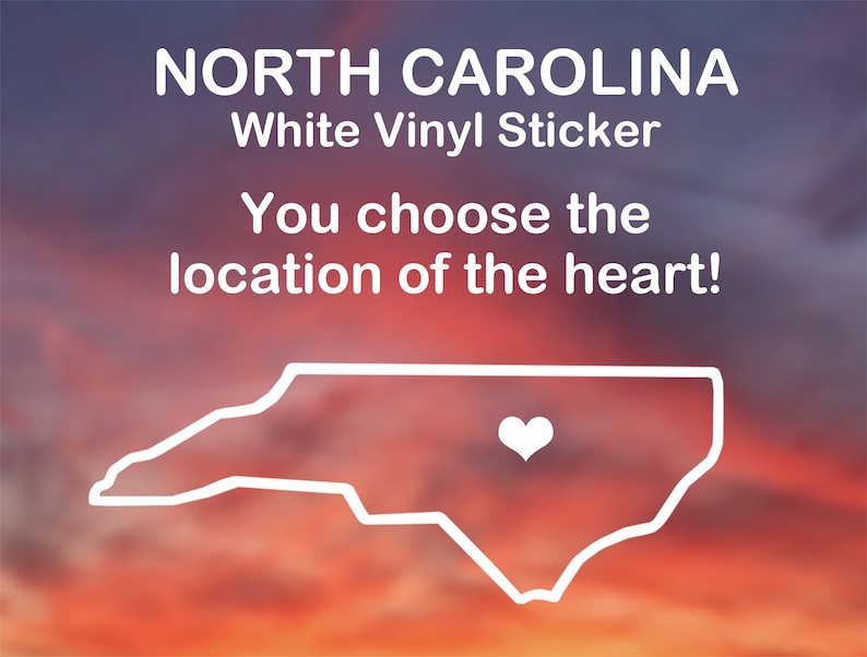 May include: White vinyl sticker of the state of North Carolina with a heart in the center. The text "NORTH CAROLINA" and "White Vinyl Sticker" is at the top of the image. The text "You choose the location of the heart!" is below the state outline.