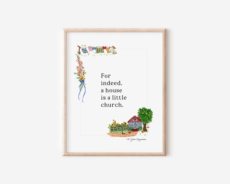 May include: Framed art print with a watercolour illustration. The artwork shows a red house, sunflowers, and the text "For indeed, a house is a little church." A clothesline with washing is depicted at the top.