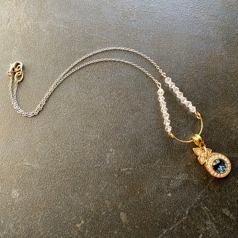 delicate brass chain, vintage crystals, a repurposed clip on earring glittering with rhinestones and a beautiful sapphire crystal image 3